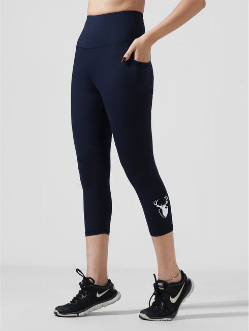 Traction Navy Pocket Capri Legging in Cloud Compression
