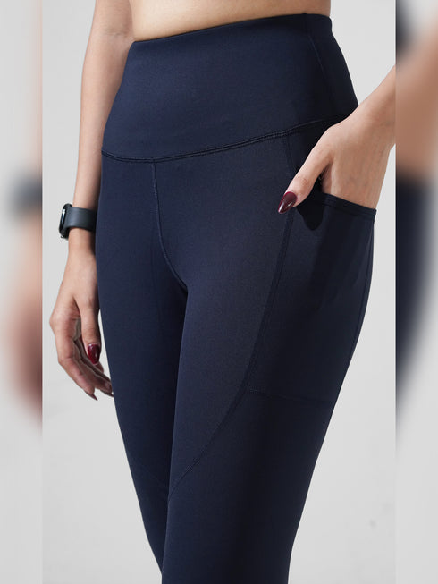 Traction Navy Pocket Capri Legging in Cloud Compression
