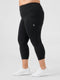 Leera black plus size capri pocket legging side view with white sneakers