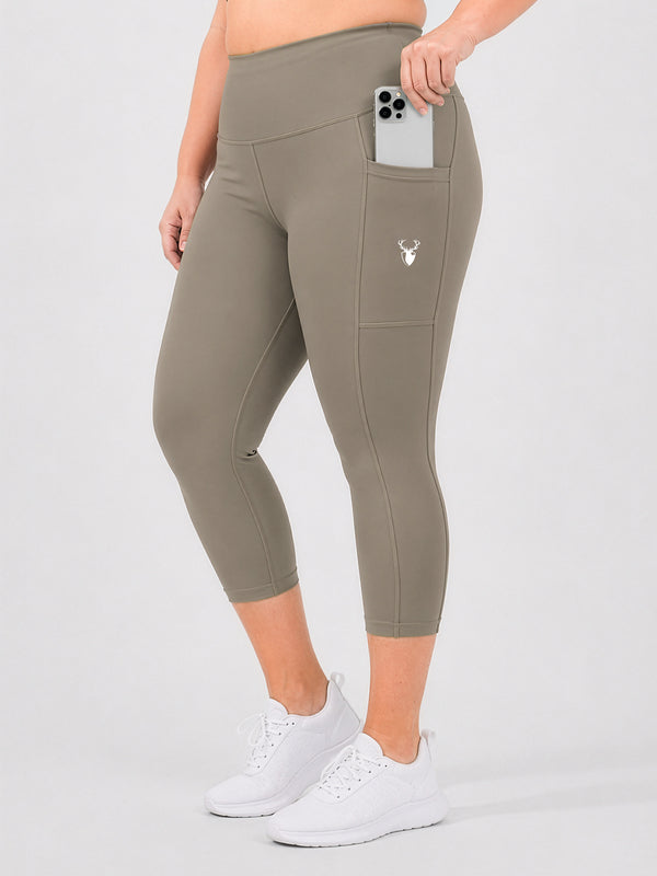 Leera dust brown plus size capri pocket legging front view with white sneakers