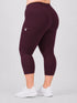 Leera maroon plus size capri pocket legging back view with white sneakers