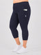 Leera navy blue plus size capri pocket legging side view with white sneakers