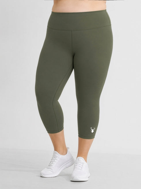 Leera olive basic plus size capri legging front view with white sneakers