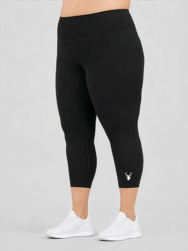 Leera black basic plus size capri legging front view with white sneakers